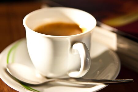 Cup of coffee and bookの写真素材