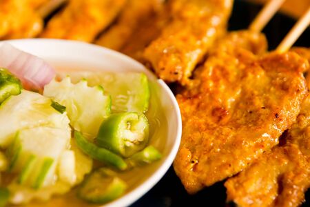 Curry power roasted grilled pork, eat with pickle, Chinese foodの写真素材
