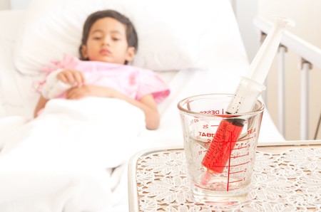 Young boy in hospital bedの写真素材