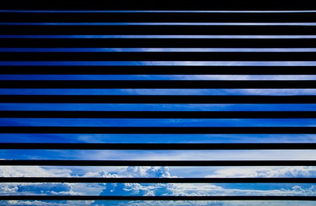 Blue sky looked from inside of houseの写真素材