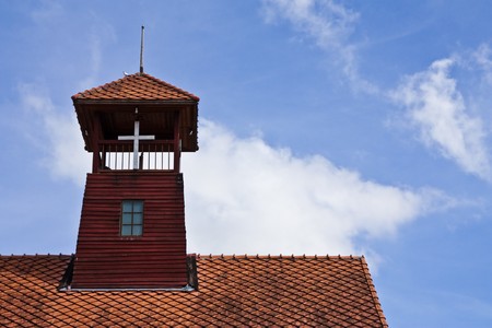 Tower on roof of old church in north of Thailandの写真素材