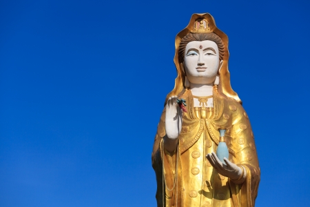 Statue of supreme Chinese god and blue skyの写真素材