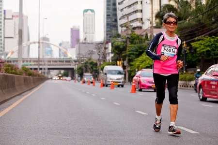 BANGKOK, THAILAND - JULY 29 : Unidentified  runner s on the street  during  Adidas King of the Road 2012  running championship on July 29, 2012 in Bangkok, Thailand.のeditorial素材