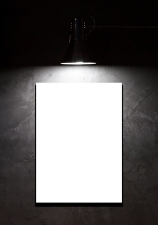 Light on blank board over concrete wallの写真素材