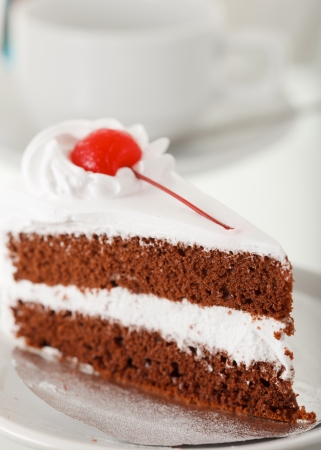 Cake with coffee cup in backgroundの写真素材