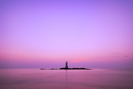 Colorful sky after sunset behide lighthouseの写真素材