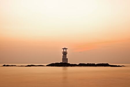 Colorful sky after sunset behide lighthouseの写真素材