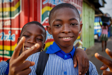 Faces of two young african boys looking at cameraのeditorial素材