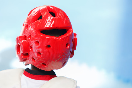 Bright red Teakwondo helmet on kid's headの写真素材