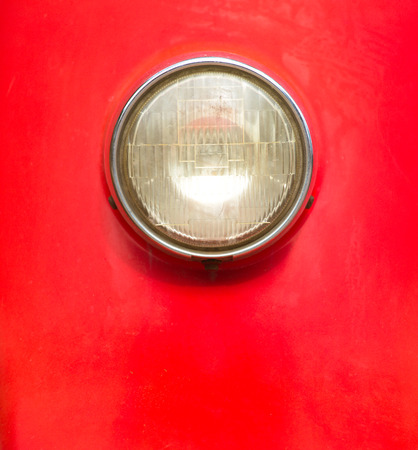 Vintage style motorcycle light with red bodyの写真素材