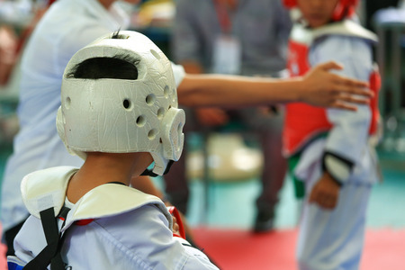 Referee gives signal to young Taekwondo athletesの写真素材