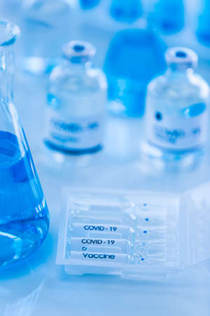 Bottle of COVOD-19 vaccine sample in a laboratory. Idea for researching and lab tests for...