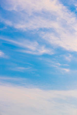 Blue sky and white  clouds background in sunny day.の写真素材