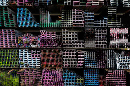 Stack of  vareity shapes colorful metal in iron store, steel warehouse for heavy industry or general buildingの写真素材