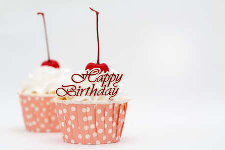 Beautiful cup cake with red cherry on top
