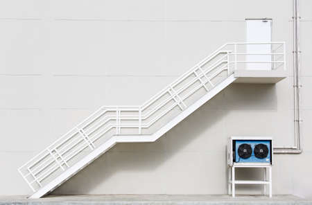White clean metal stairs on concrete wallの写真素材
