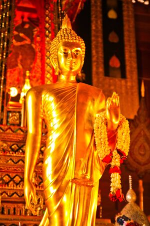 Buddha in wooden templeの写真素材
