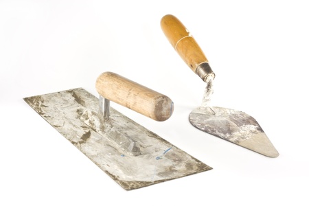 Old dirty trowels  isolated on white backgroundの写真素材