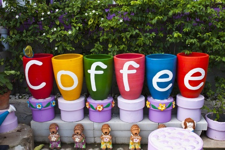 Bright colourful pottery and pottery dollsの写真素材