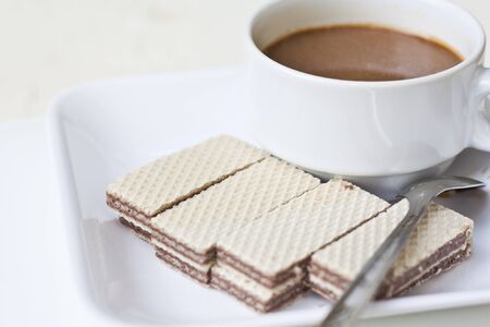 Crispy wafers and a cup of coffeeの写真素材