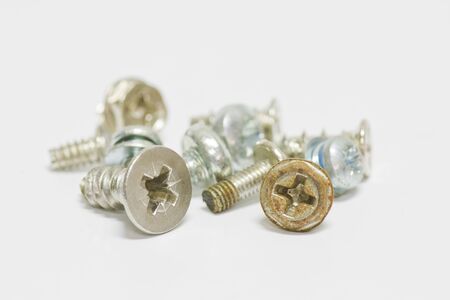 Little screws on white background with shallow focusの写真素材