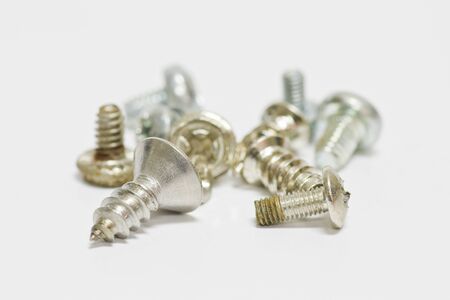 Little screws on white background with shallow focusの写真素材