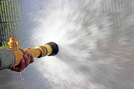 Firefighter fighting For A Fire Attack, During A Training Exerciseの写真素材