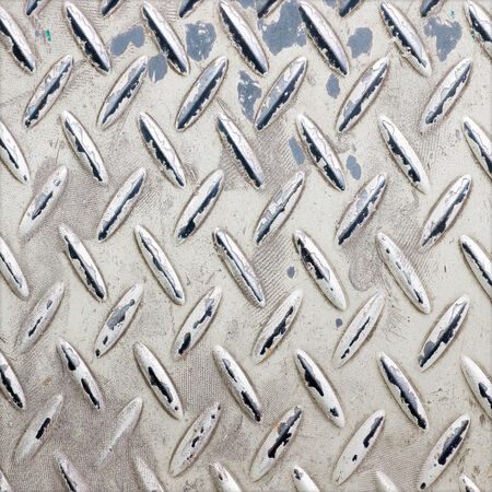 Background of metal diamond plate in silver color.の写真素材