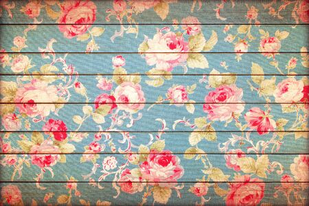 rose vintage from fabric on wooden background.の写真素材