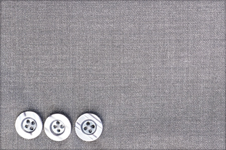 plastic buttons on fabric background