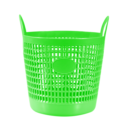 Small green plastic basket isolated on whiteの写真素材