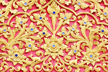 stucco design of native thai style on the Wallの写真素材