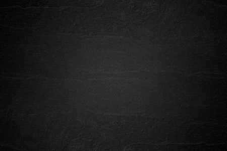 Dark grey black slate background or natural stone texture.の写真素材