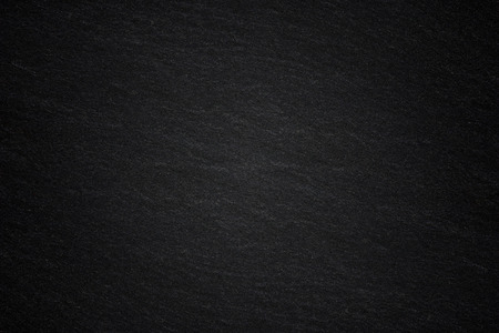 Dark grey black slate background or natural stone texture.の写真素材