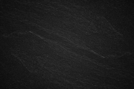 Dark grey black slate background or natural stone texture.の写真素材