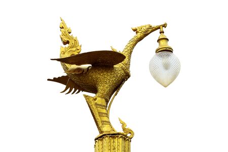 Golden swan there is a lamp at the mouth.の写真素材