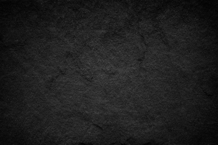Dark grey black slate background or natural stone texture.の写真素材