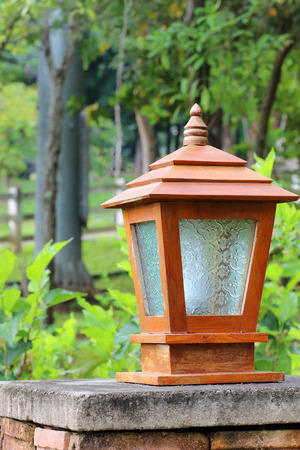 Wooden lamp in the garden backgroundの写真素材
