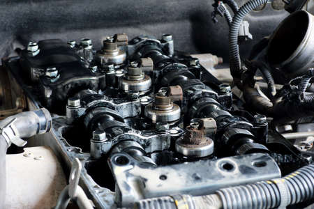 broken car engine, Old engine open valve cover for repairing.
