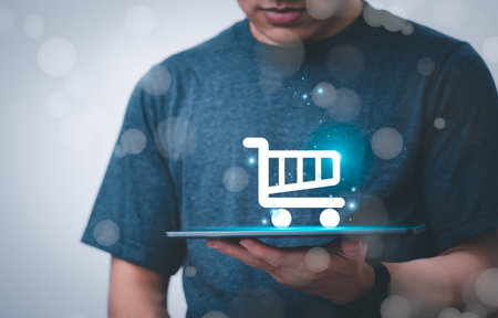 Businessman using phone, displaying online virtual reality holographic shopping carts, the concept of global data connection with technology internet, big data, information search, online marketingの写真素材