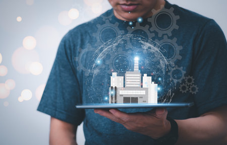 Businessman using phone,  showing online virtual hologram factories With internet technology, the concept of global data connection with technology internet, big data, information search, industryの写真素材
