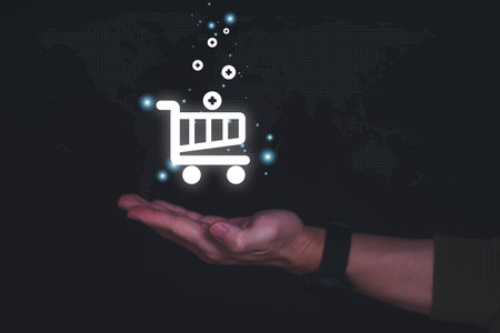 planning and strategy, business growth, progress or success concept, shopping cart is displayed as a virtual hologram on male hand, online shopping, information search, marketing onlineの写真素材