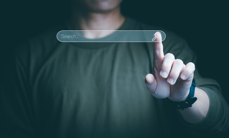 Information search technology, search engine optimization, male hand using a smartphone to search information, using search bar function on your website, Big Dataの写真素材