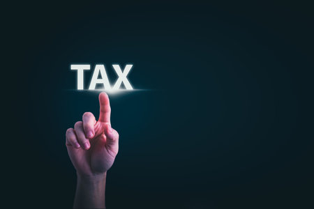 financial research government tax and calculation tax return concept Businessman showing holographic tax on hand Online tax return form filling concept for payment, online marketing, business process.の写真素材