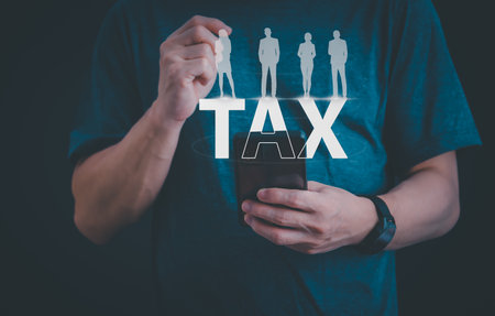 financial research government tax and calculation tax return concept Businessman showing holographic tax on hand Online tax return form filling concept for payment, online marketing, business process.の写真素材