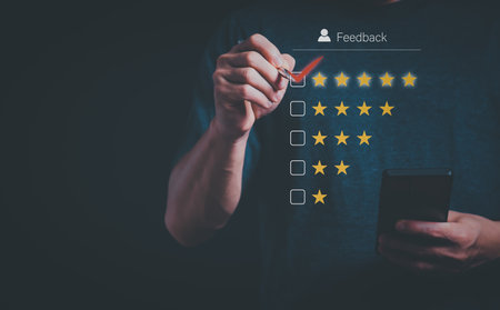 Satisfaction survey concept and customer service, using digital media technology, questionnaire, and rating satisfaction, rating satisfaction five stars, searching for information, online marketingの写真素材