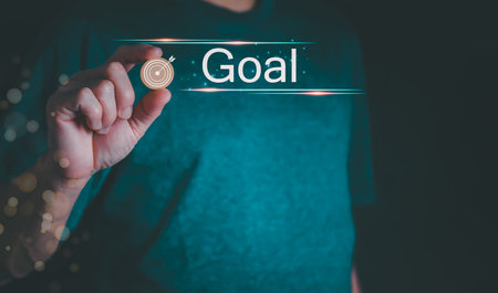The person showing hologram "Goal" text in hand, progress concept or success concept, global data connection, big data, data search, big data, and business process.の写真素材