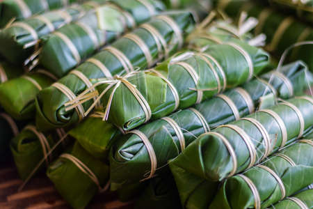 Thai dessert made from bean, and sticky rice ,Wrapped in Banana Leave for eating on chinese new year festivalの写真素材