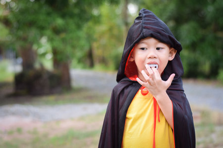 Happy kid in halloween costumes. halloween holiday conceptの写真素材