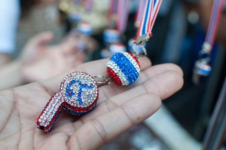BANGKOK THAILAND - FEBRUARY 9, 2014   Whistles and national flag tri-coloured ribbons, Tools and or souvenirs of  Bangkok Shutdown  protest  At Sala Daeng intersection のeditorial素材